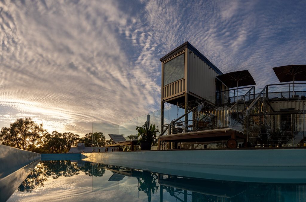 Callubri Sky Suites and pool beneath a patterned evening sky