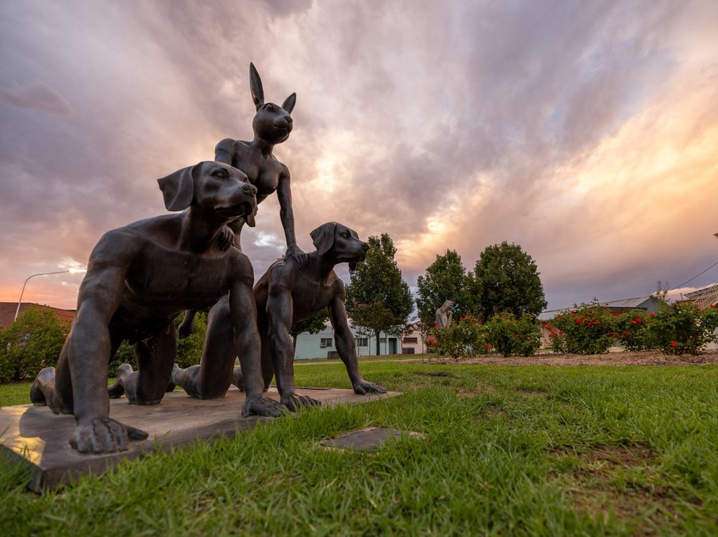 Kangaroo sculptures beneath a dramatic sky